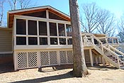 Gabled cedar porch with lattice