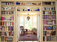 Custom built in bookcases around French doors